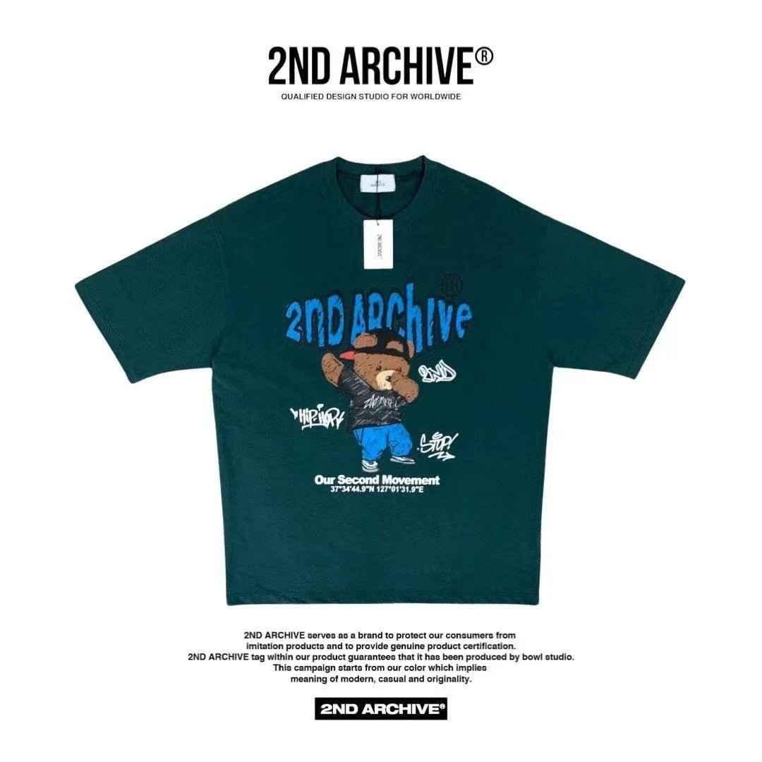 Deep green oversized T-shirt with blue 2ND ARCHIVE graffiti logo and cartoon bear graphic.