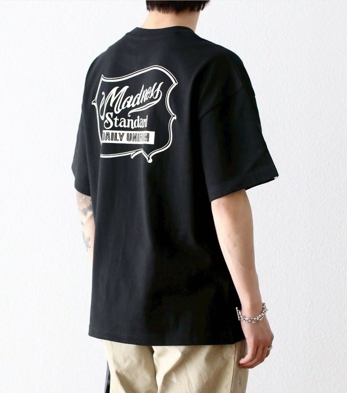MADNESS BADGE (L) UNIFORM Tee - HLY & CHOCCICO