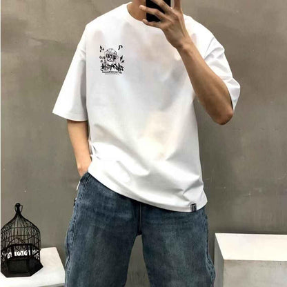 Beige oversized t-shirt with pug crayon graphic, styled with blue jeans, casual streetwear