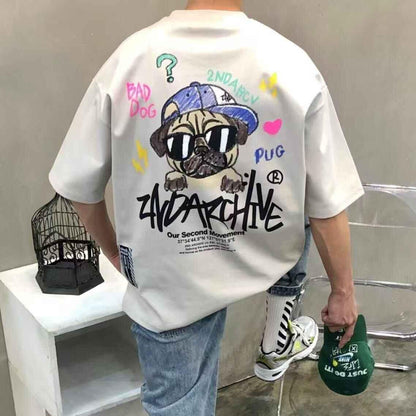 Beige oversized t-shirt with cartoon pug graphic, graffiti text, and streetwear accents