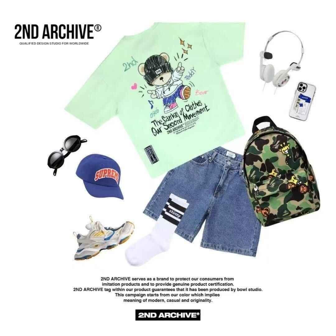 Trendy streetwear outfit with teddy bear graphic tee, denim shorts, camo backpack, sneakers, and accessories