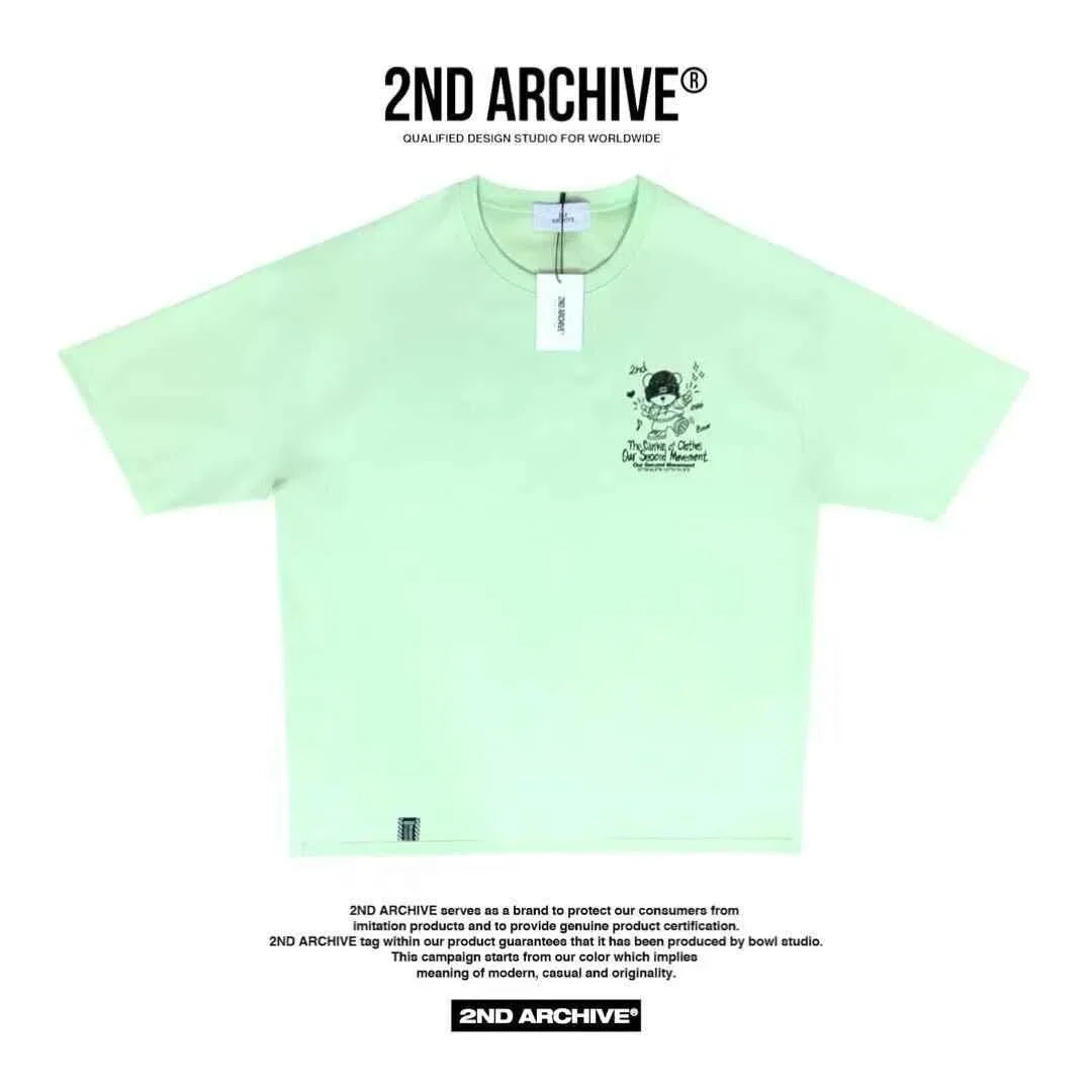 Light green short sleeve tee with cartoon teddy bear graphic and text, 2nd Archive tag visible.