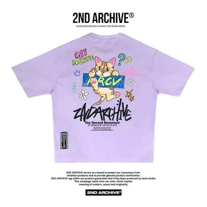 Pastel purple oversized t-shirt featuring cartoon cat graphic, doodles, and bold &