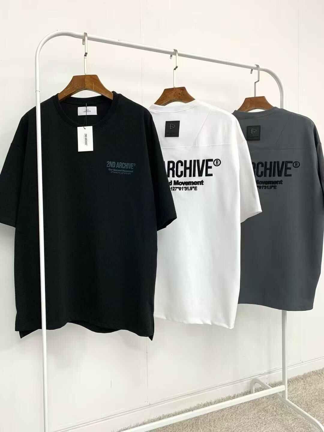 Black, white, and grey oversized short-sleeve t-shirts with &