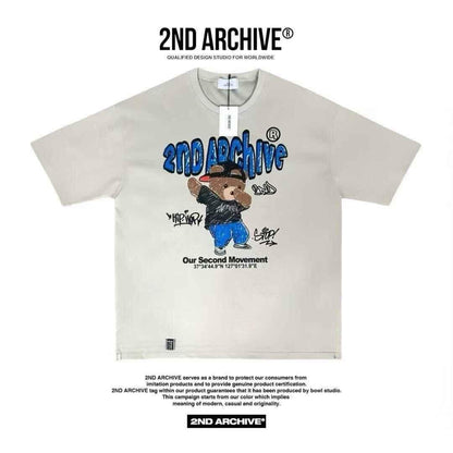 Beige graphic T-shirt with cartoon bear in hip hop outfit, blue &