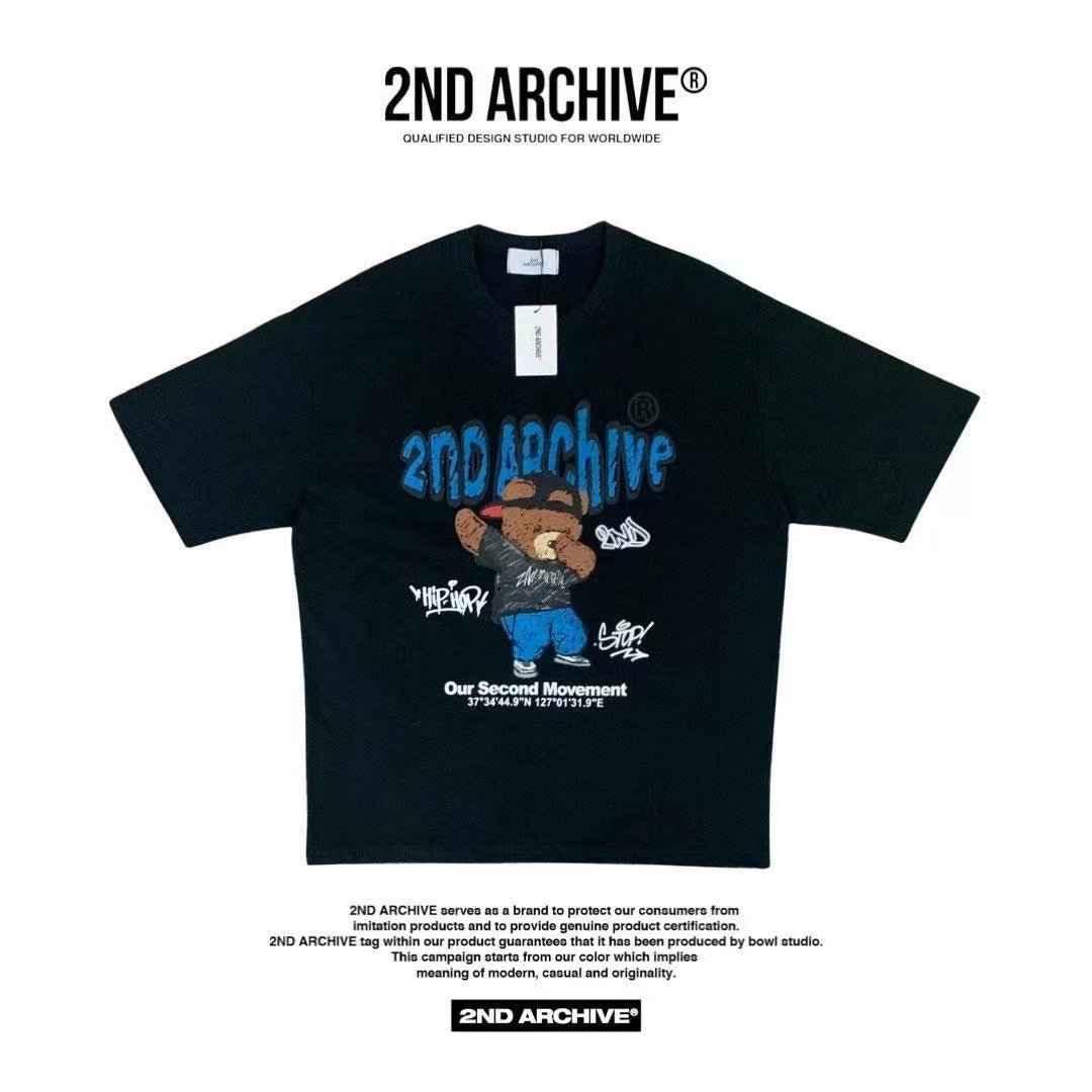 Black T-shirt with cartoon bear graphic, blue 2ND ARCHIVE text, streetwear style.