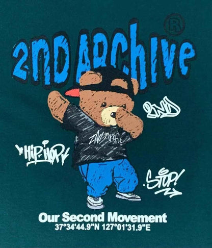 Green t-shirt with cartoon bear in streetwear, graffiti text, and &