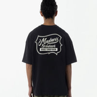 MADNESS BADGE (L) UNIFORM Tee - HLY & CHOCCICO