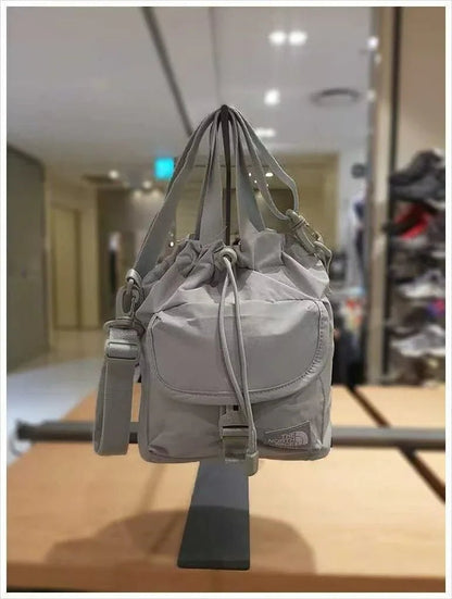 TNF BREEZE BUCKET BAG - HLY &amp; CHOCCICO